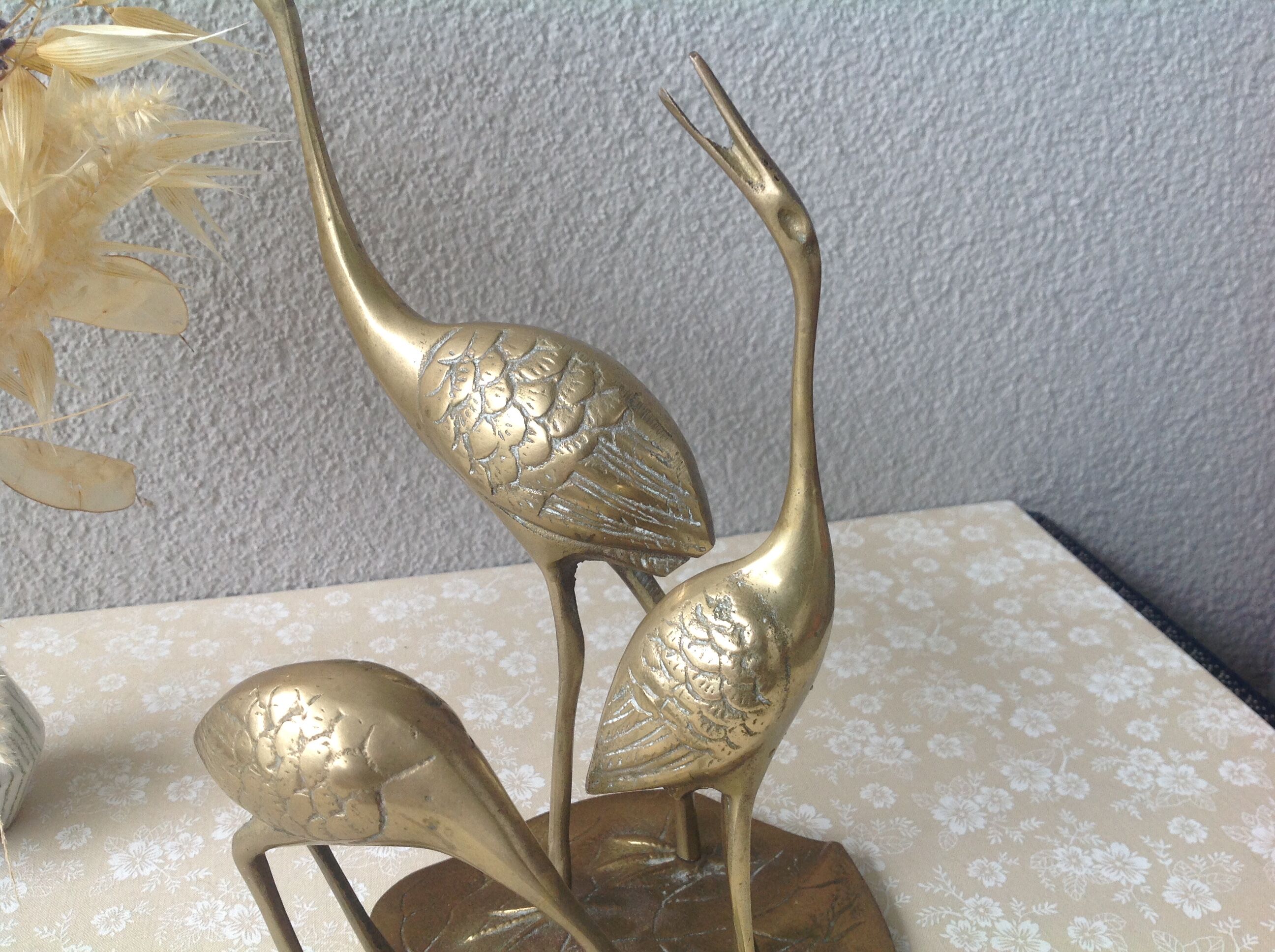 Golden brass herons