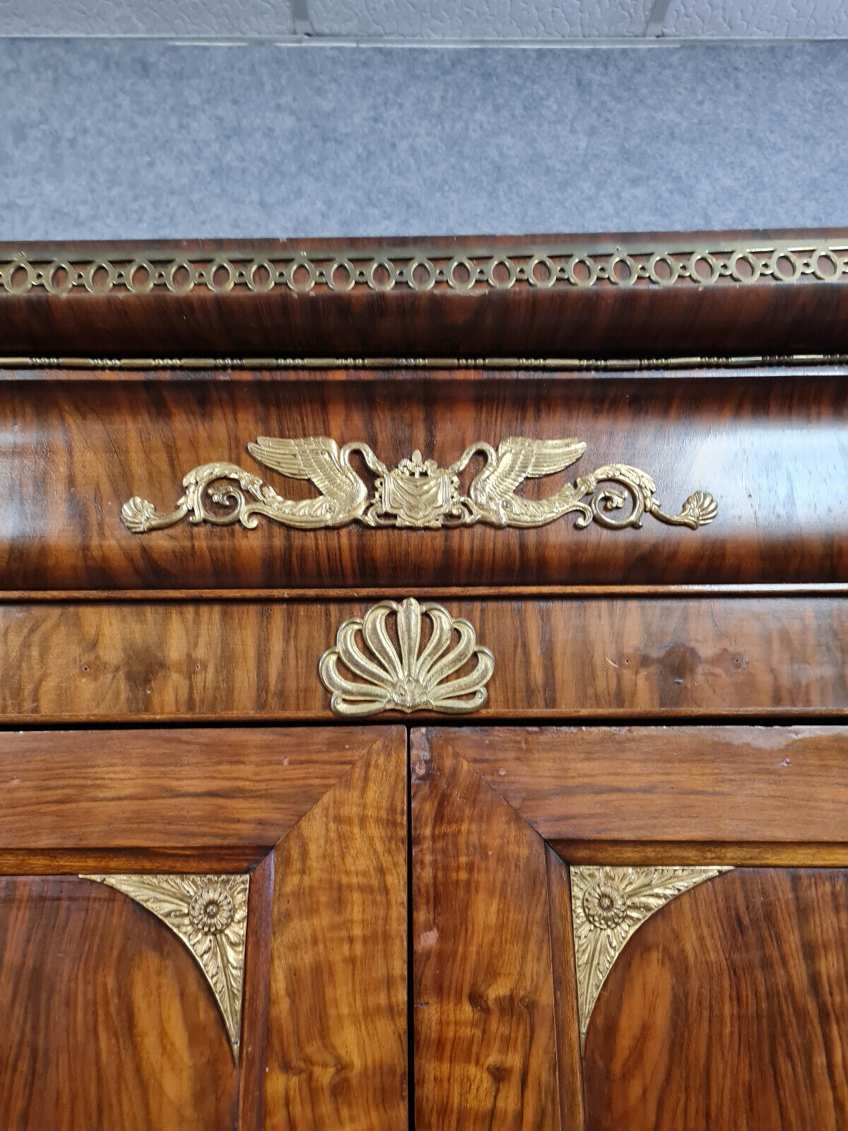 Louis Philippe period wardrobe (nineteenth) entirely covered with gilded bronzes