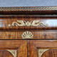 Louis Philippe period wardrobe (nineteenth) entirely covered with gilded bronzes