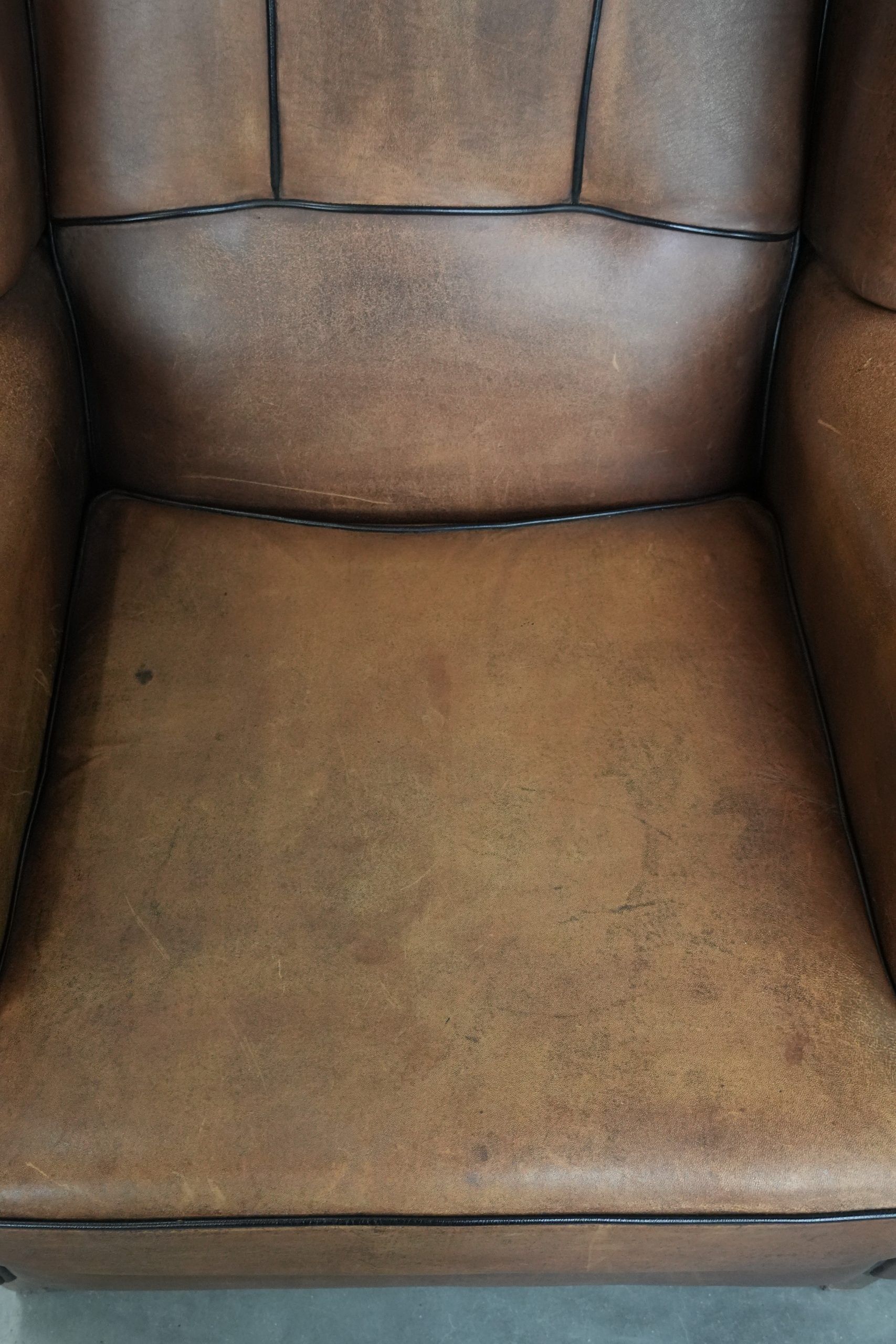 Sheepskin wingback armchair with beautiful colours in good condition