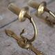 Pair of Empire style bronze wall lights, bronze wall light with palmette and swan neck.