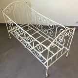 White wrought iron folding bed