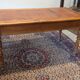 Cherry wood desk with a leather top.