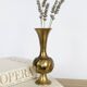 Solid brass Midcentury vase in trumpet shape with twisted details.