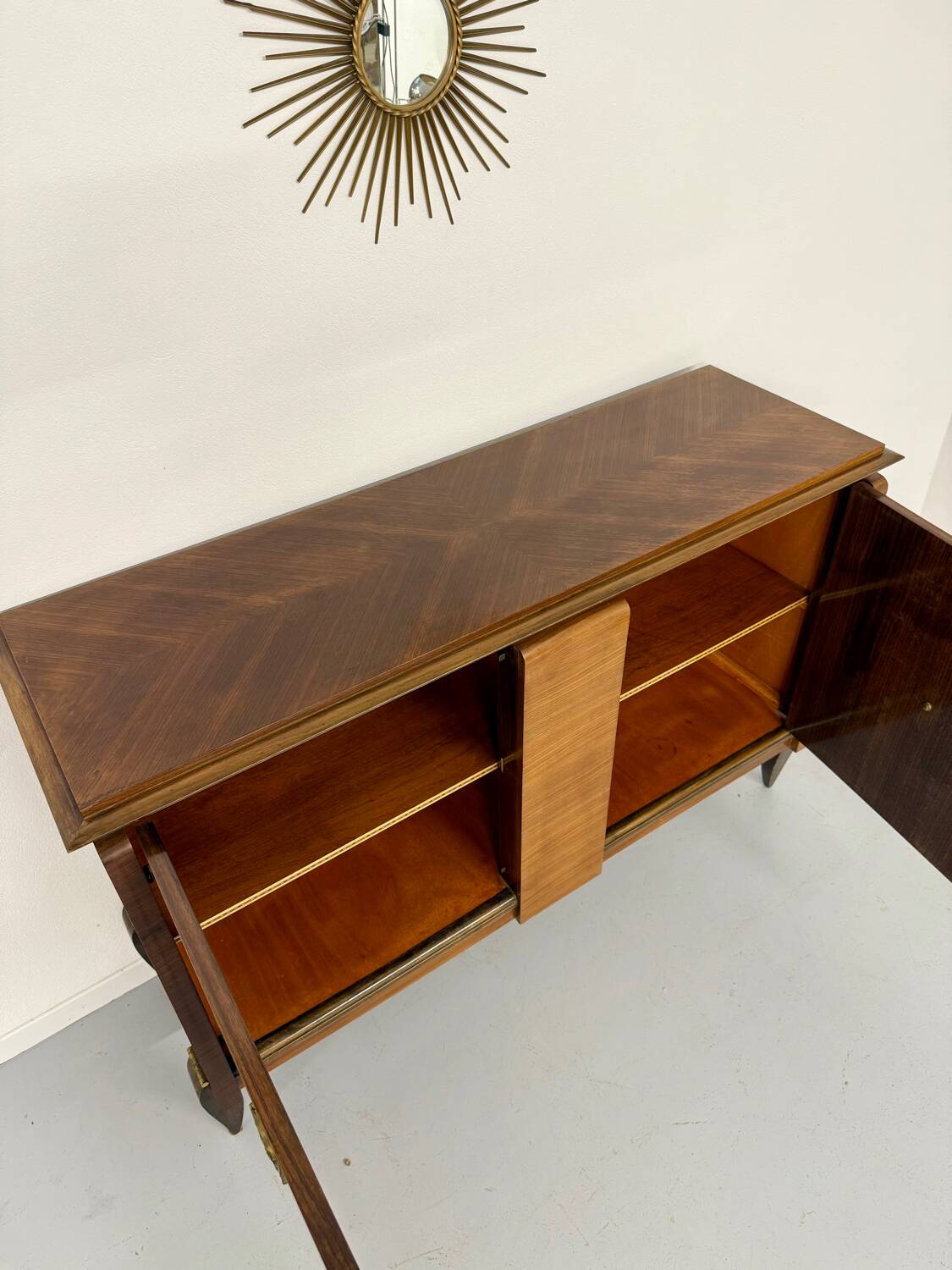 Antique art deco sideboard from the 1930s with veneered wood and bronze insert