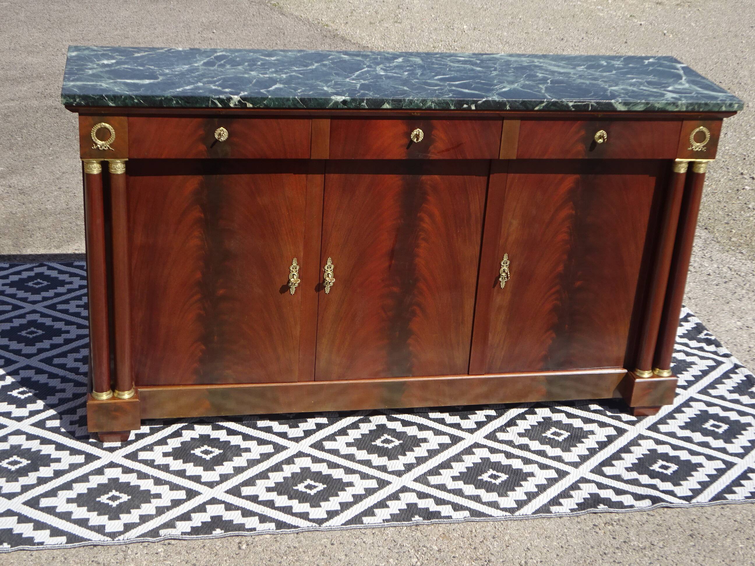 Flamed mahogany enfilade with sea green marble in Empire style.