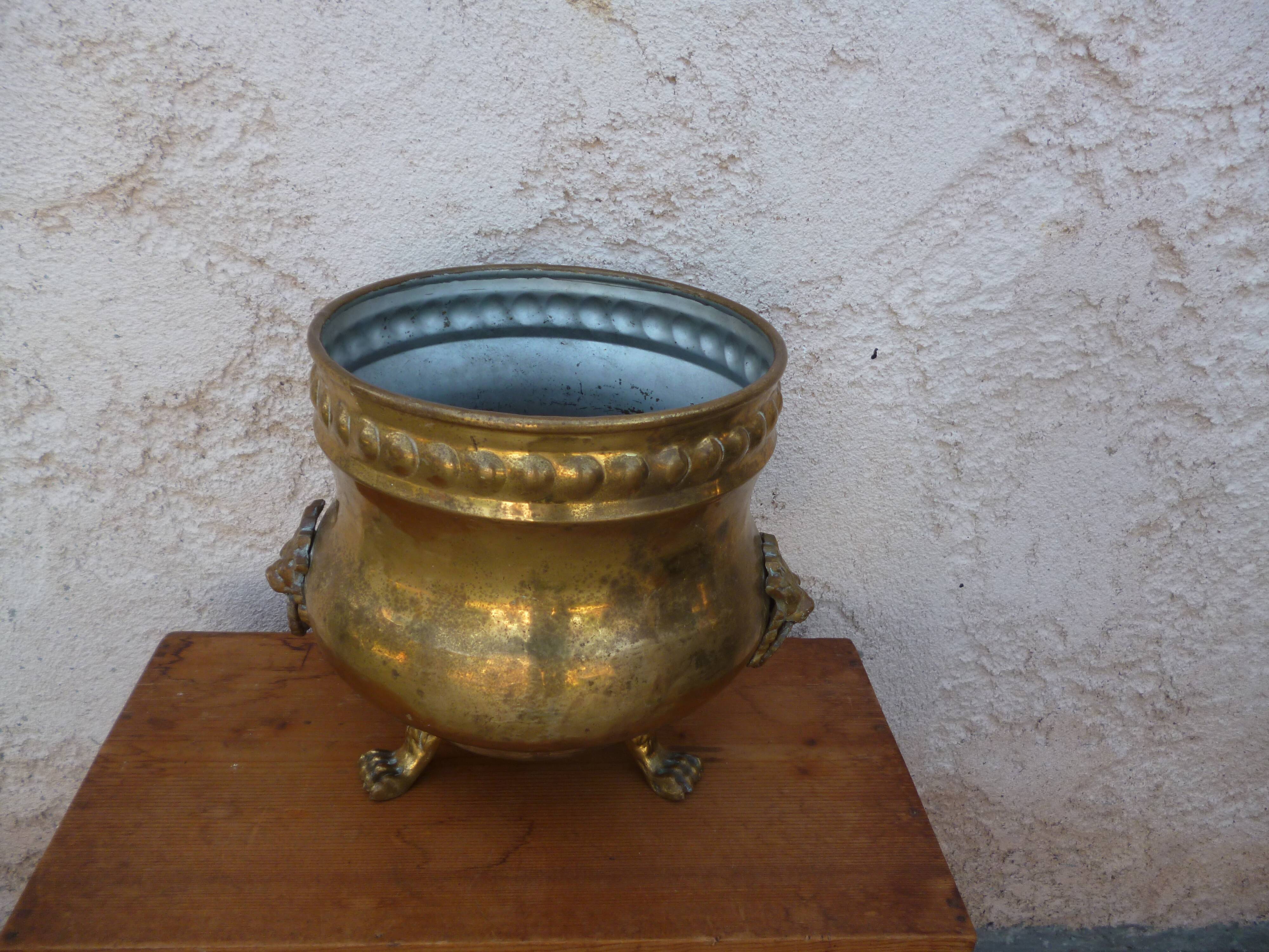 Antique lion heads brass pot cover