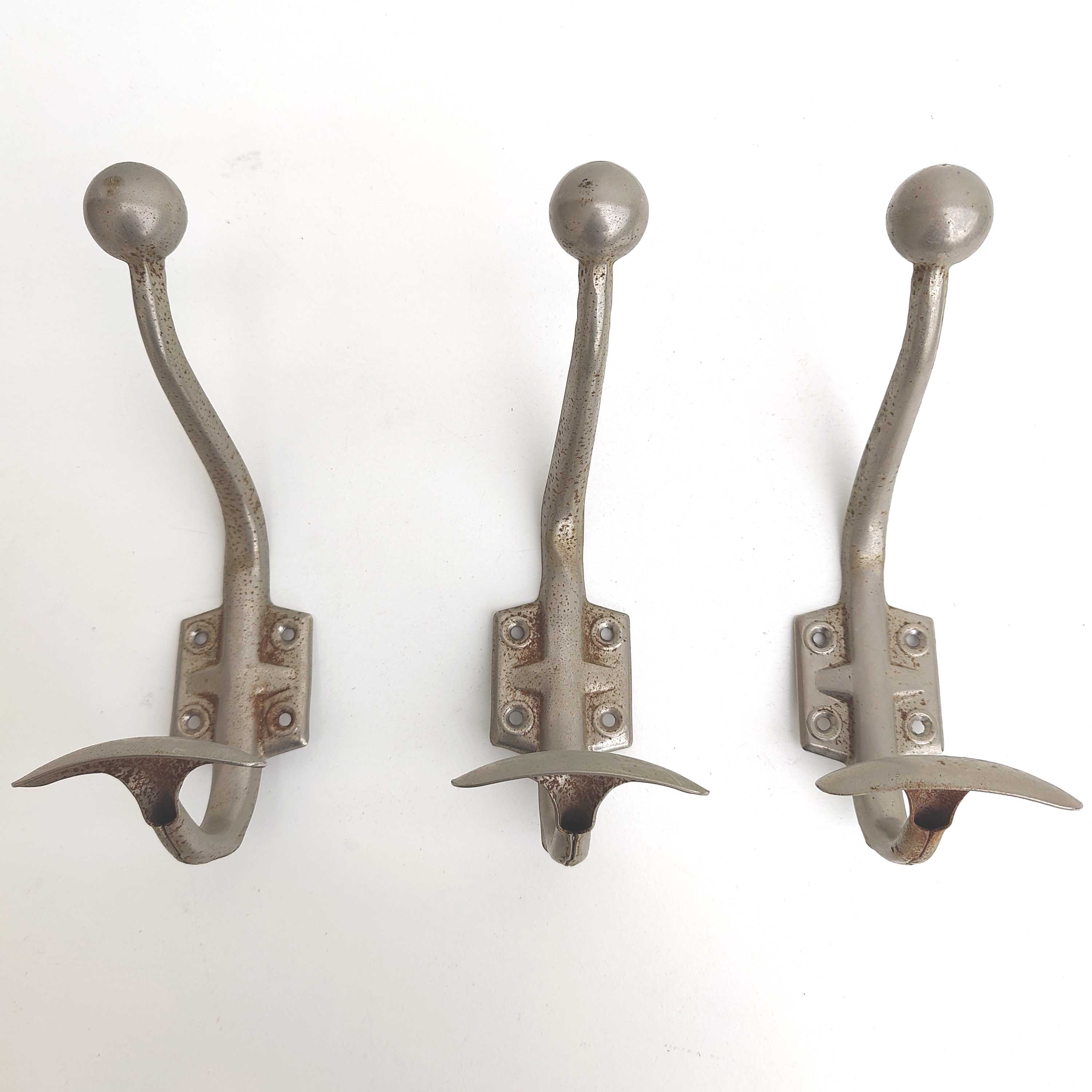 Three metal hooks