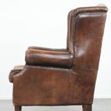Vintage wingback armchair made of sheepskin leather with beautiful colours