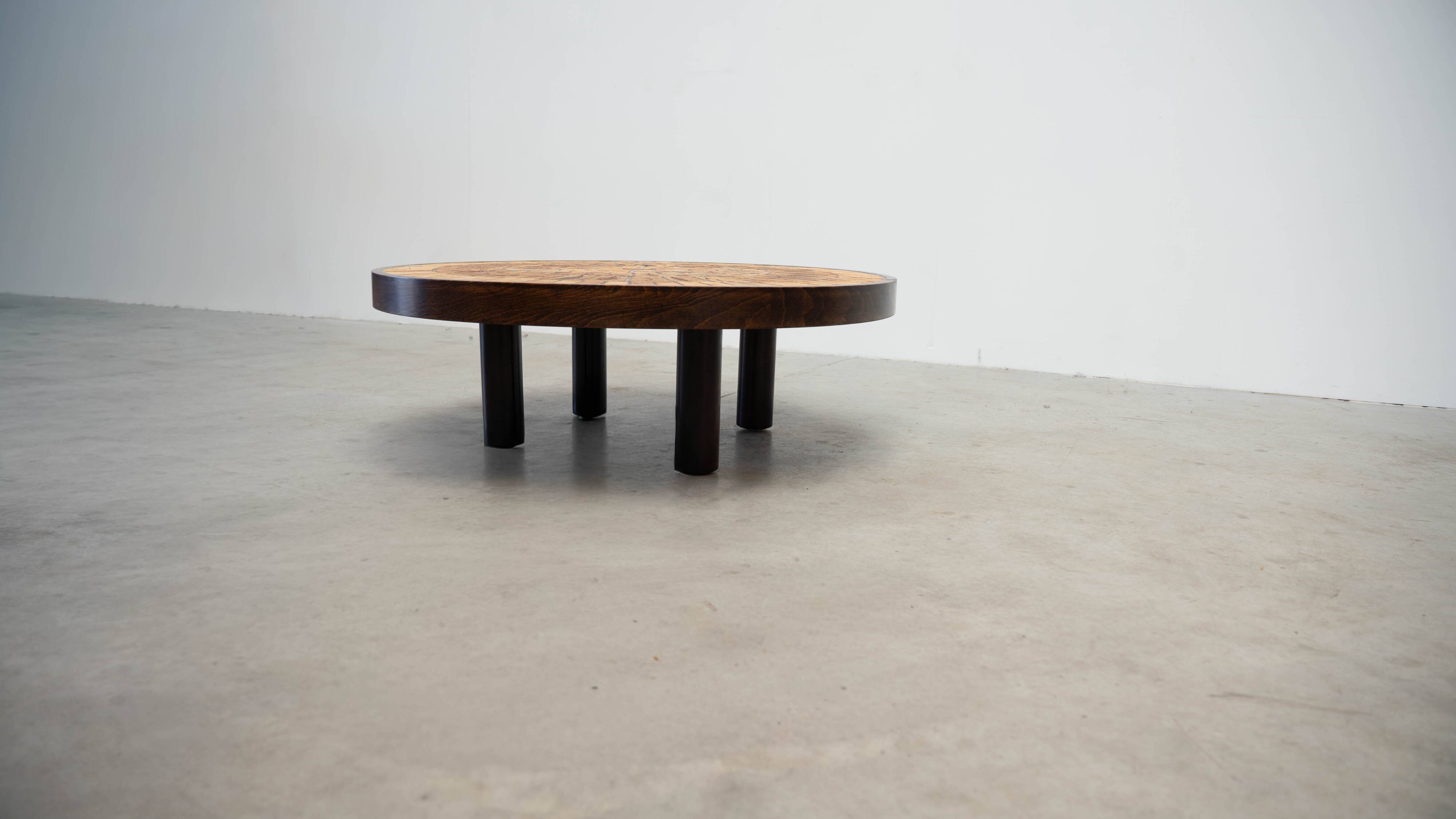 Round coffee table by Roger Capron