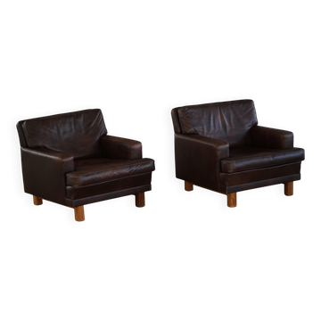 Paire de chaises longues modernes danoises en cuir brun foncé et bois de rose, années 1960