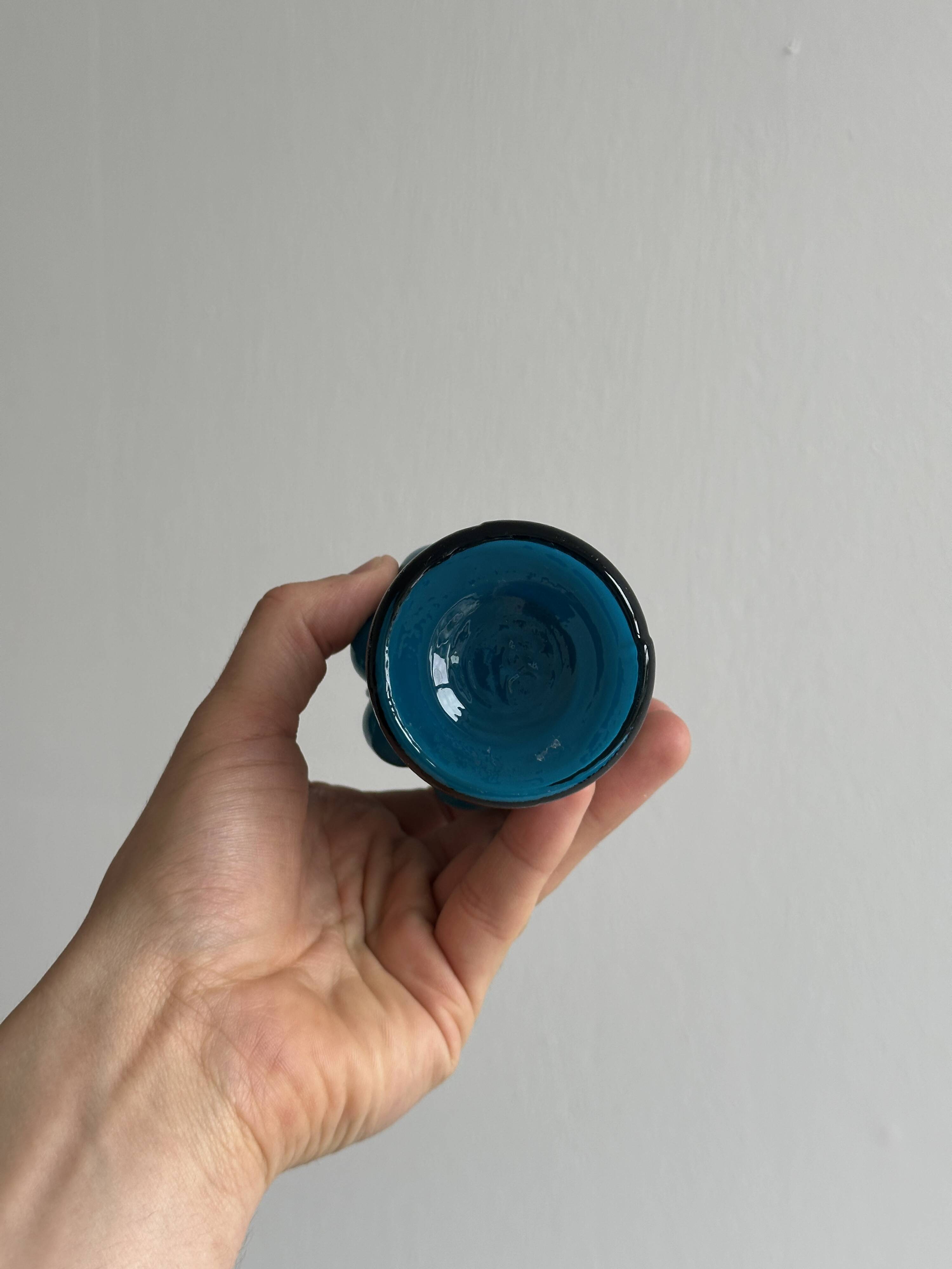 Small deep blue vase with reliefs