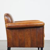 Sheep leather Art Deco design armchair finished with black piping