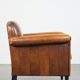 Sheep leather Art Deco design armchair finished with black piping