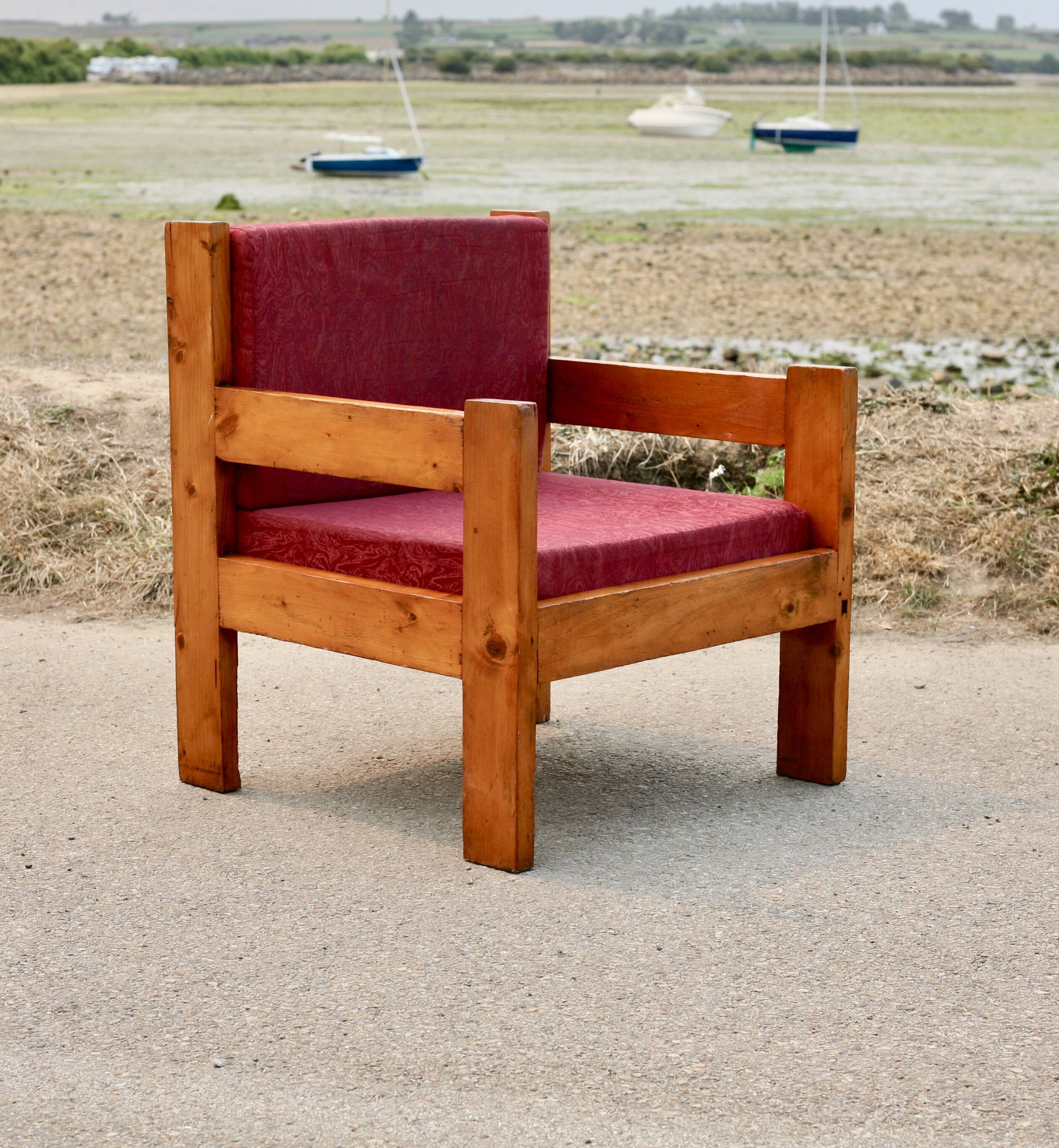 Pair of pine fireside chairs, France, 1960s, "raspberry" cushions