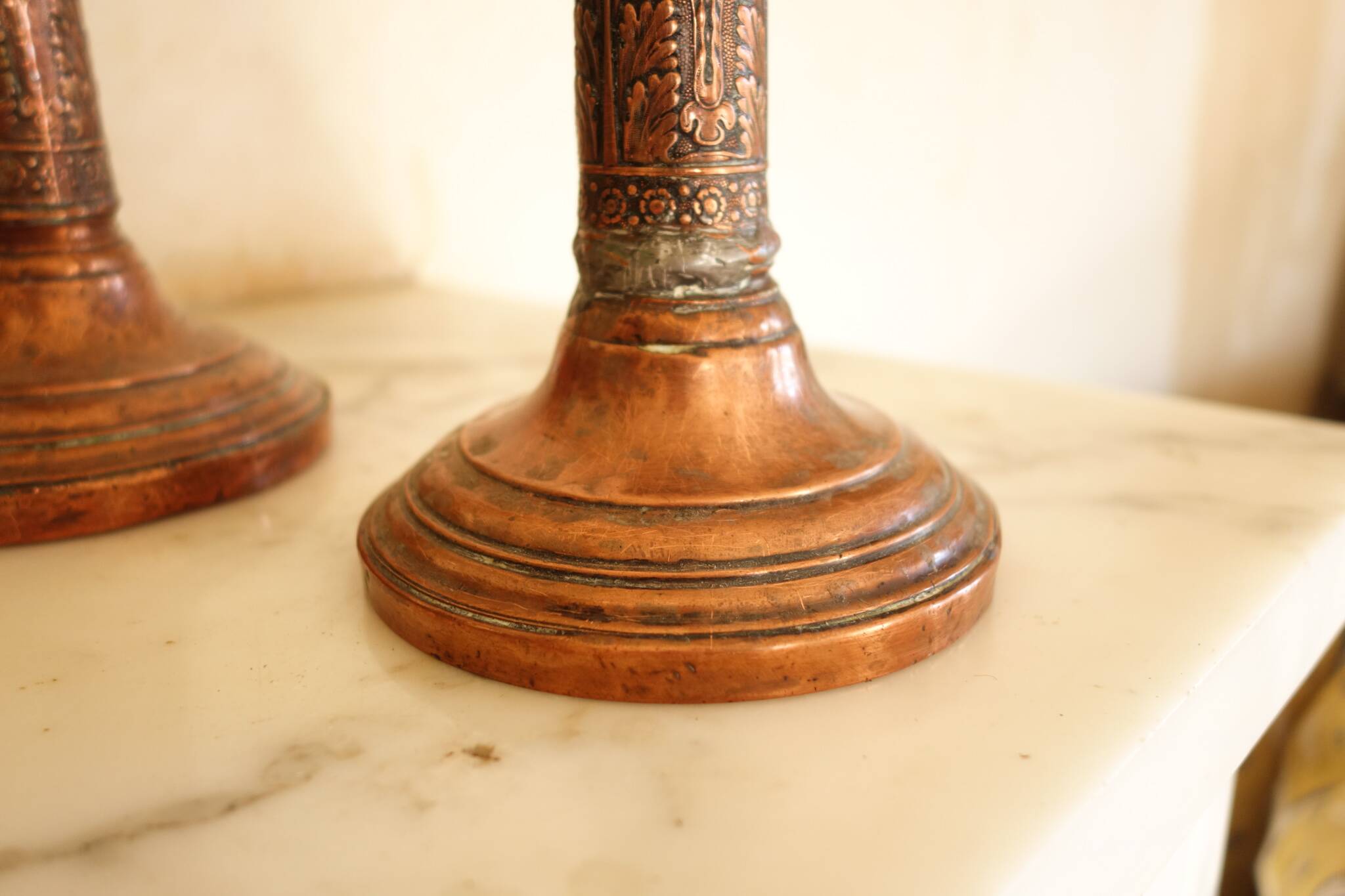Pair of antique copper candlesticks