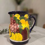 Ceramic pitcher with fruit and vine decoration - colorful rustic style