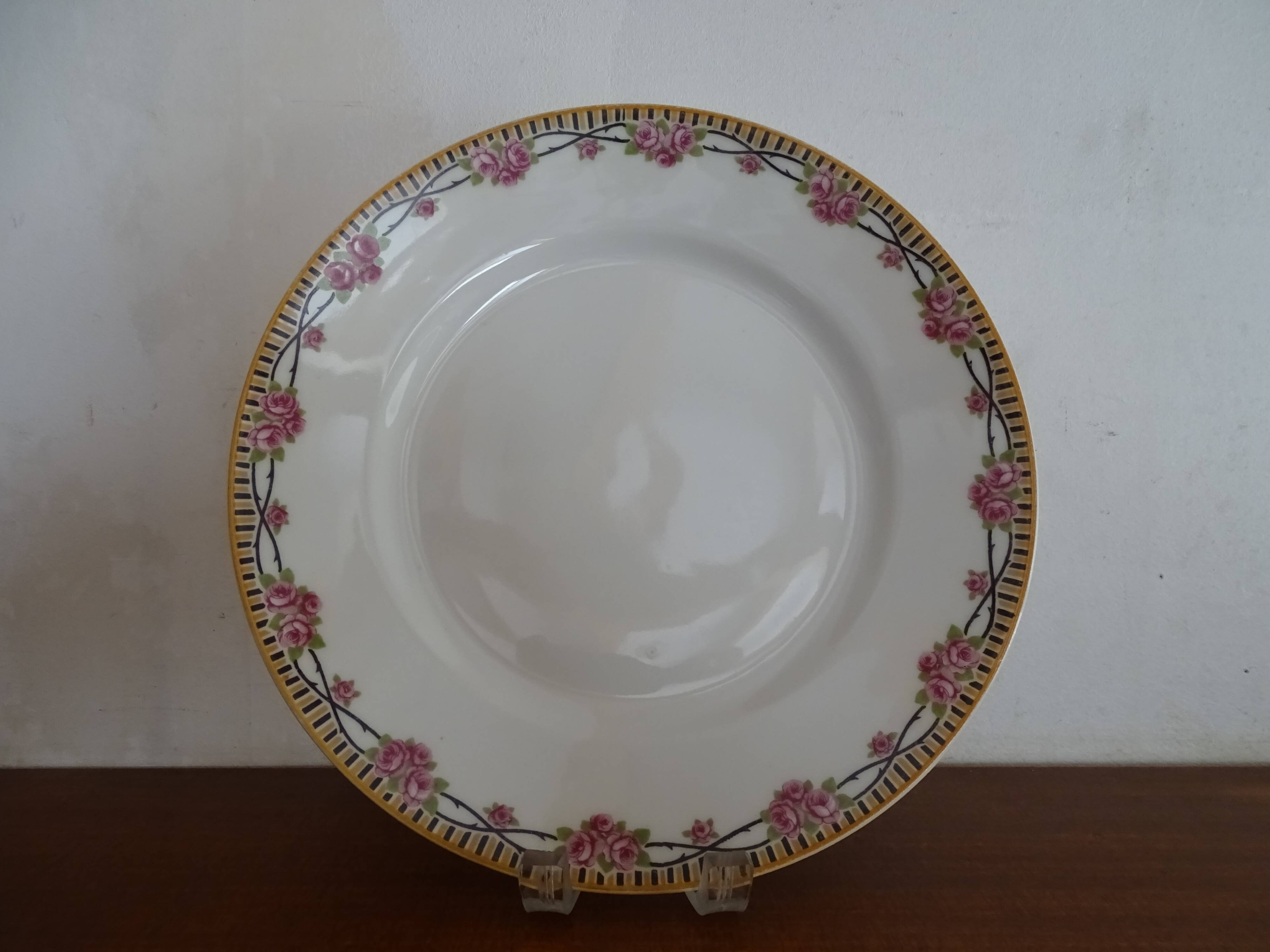 4 assiettes plates porcelaine Limoges Theodore Haviland motifs Art Deco Ø 24, cm
