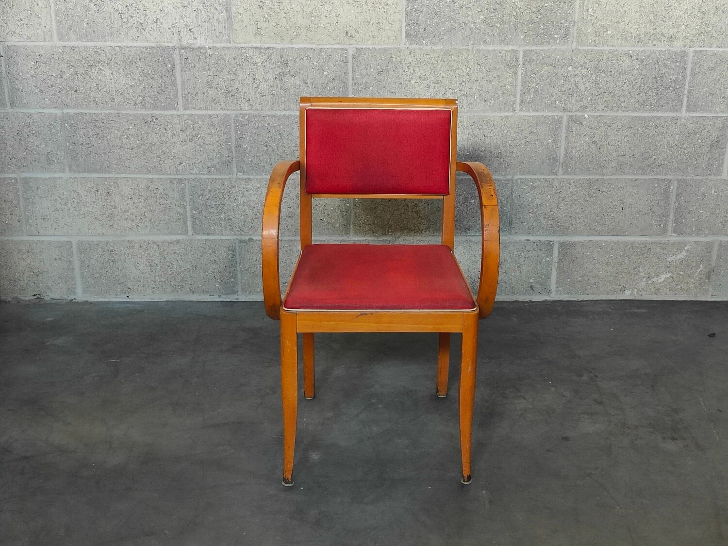 Small red bridge chair with armrests