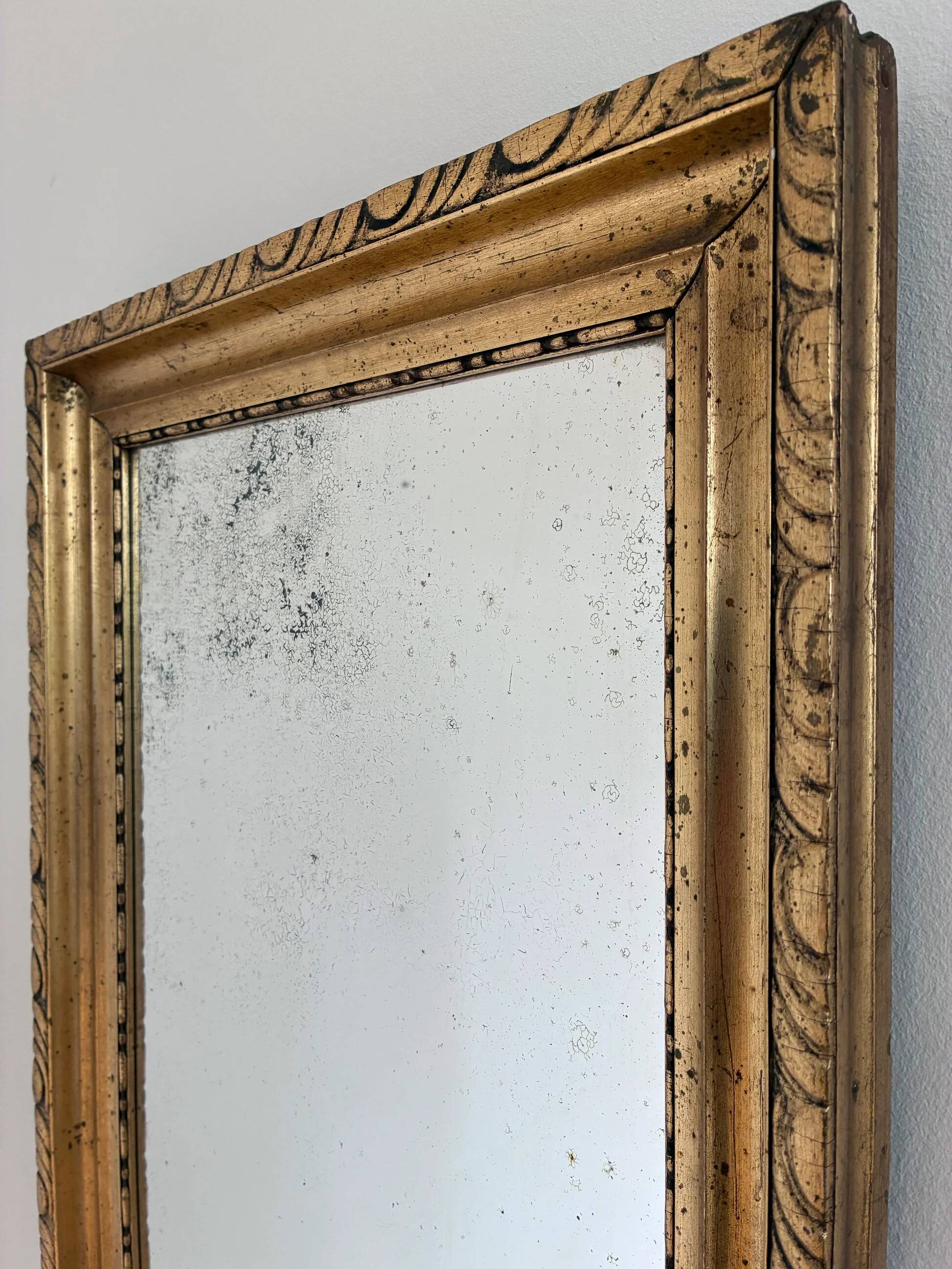 Antique French giltwood wall mirror in gold