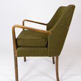 Armchair in birch and orginal dark green fabric of danish design from the 1950