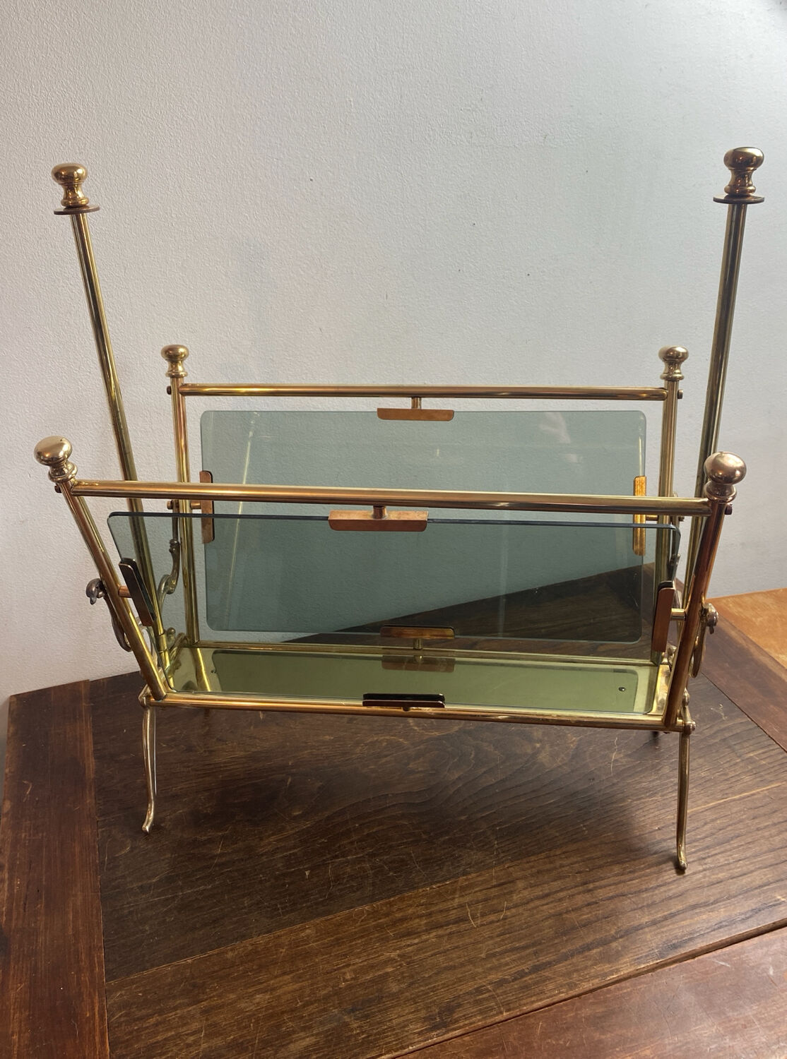 Brass magazine rack and blue-tinted glasses, 1950s.