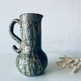 Old pitcher in glazed terracotta