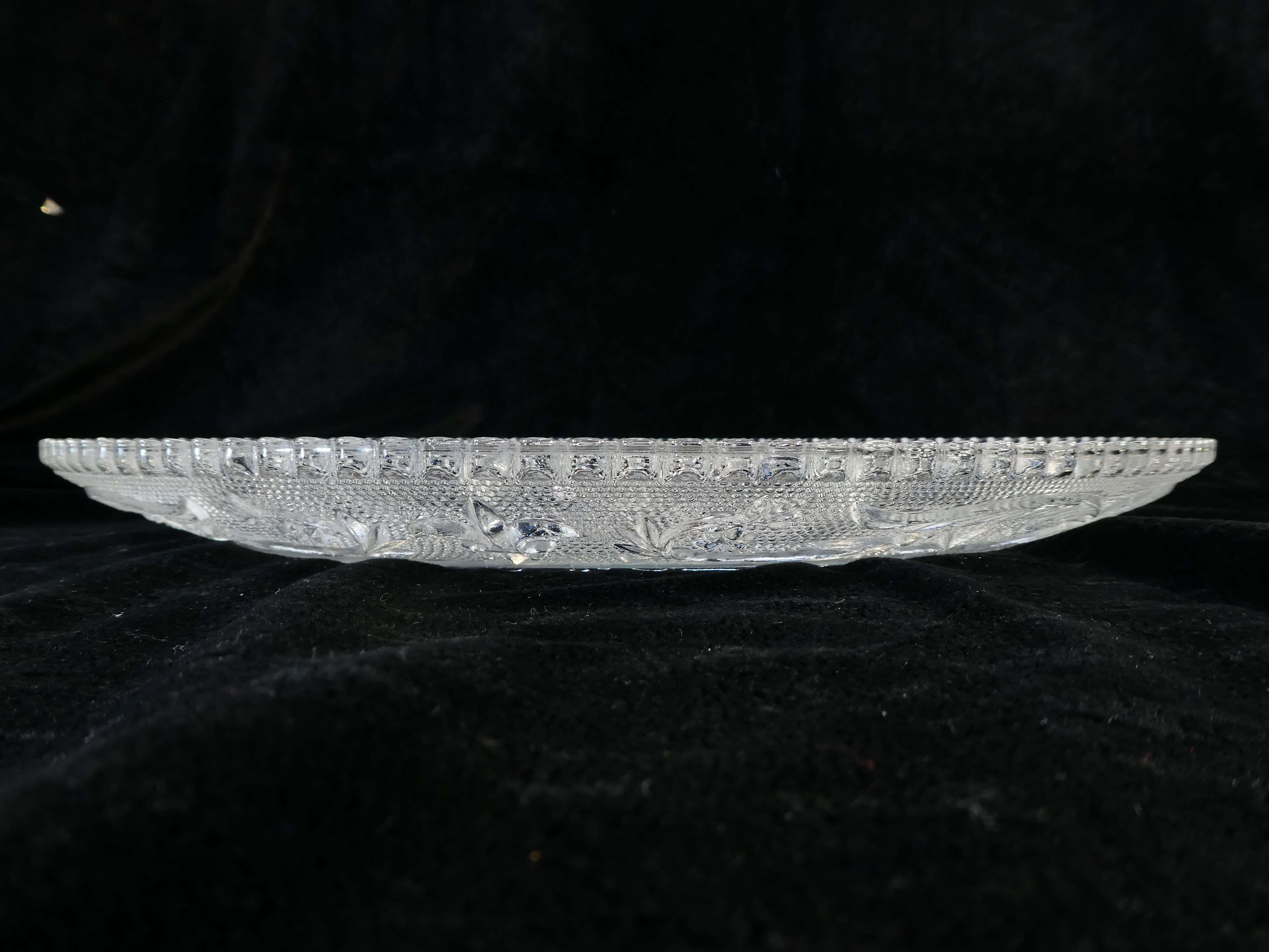 Old plate with pressed glass arabesque pie