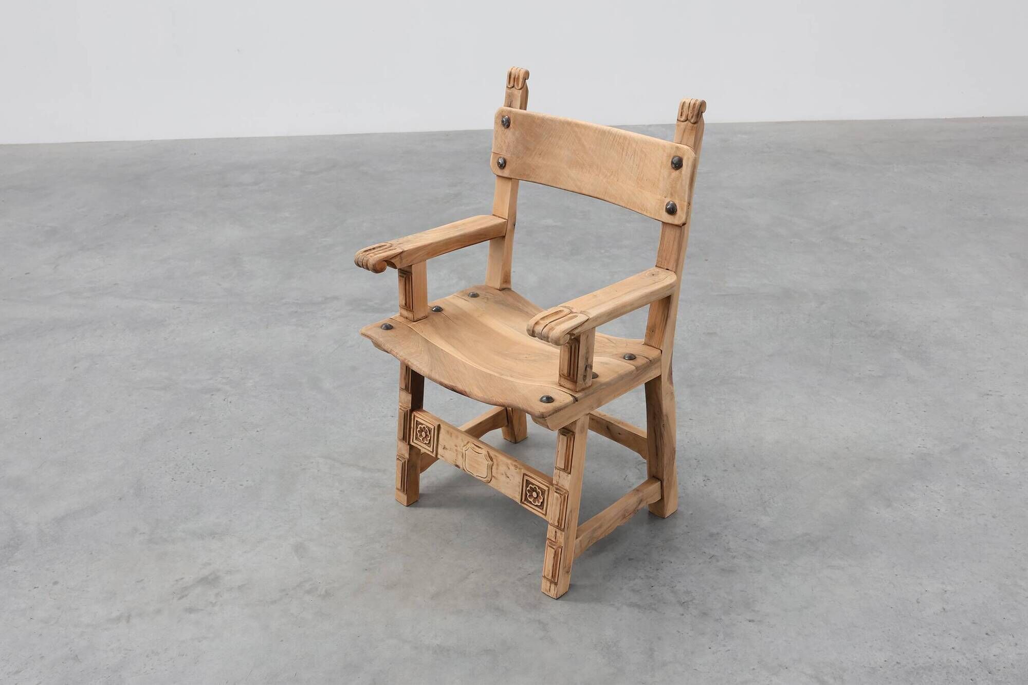 Brutalist armchair with carved rosettes and nailed wooden seat, Spain, 20th