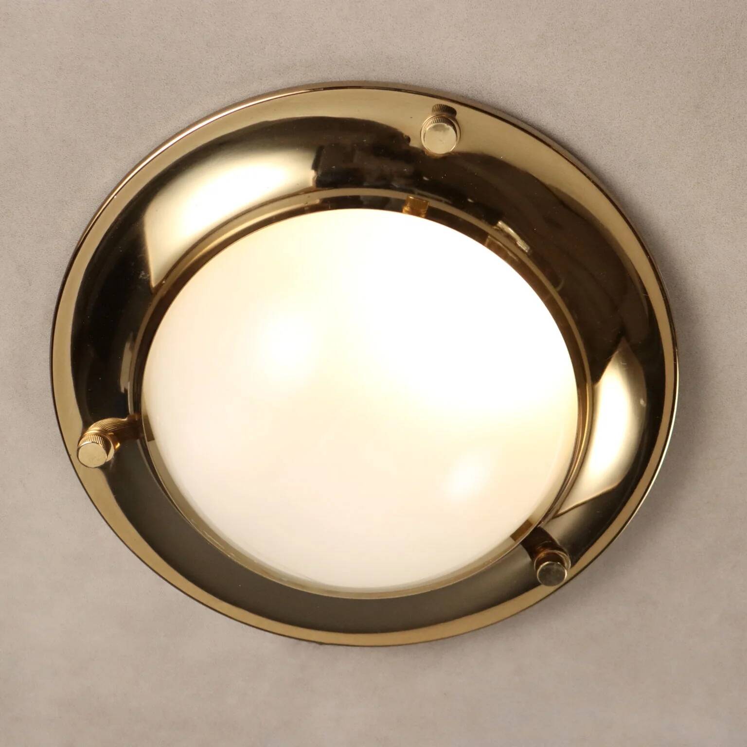 Vintage wall light in aluminium, brass, and glass, 1970s design.