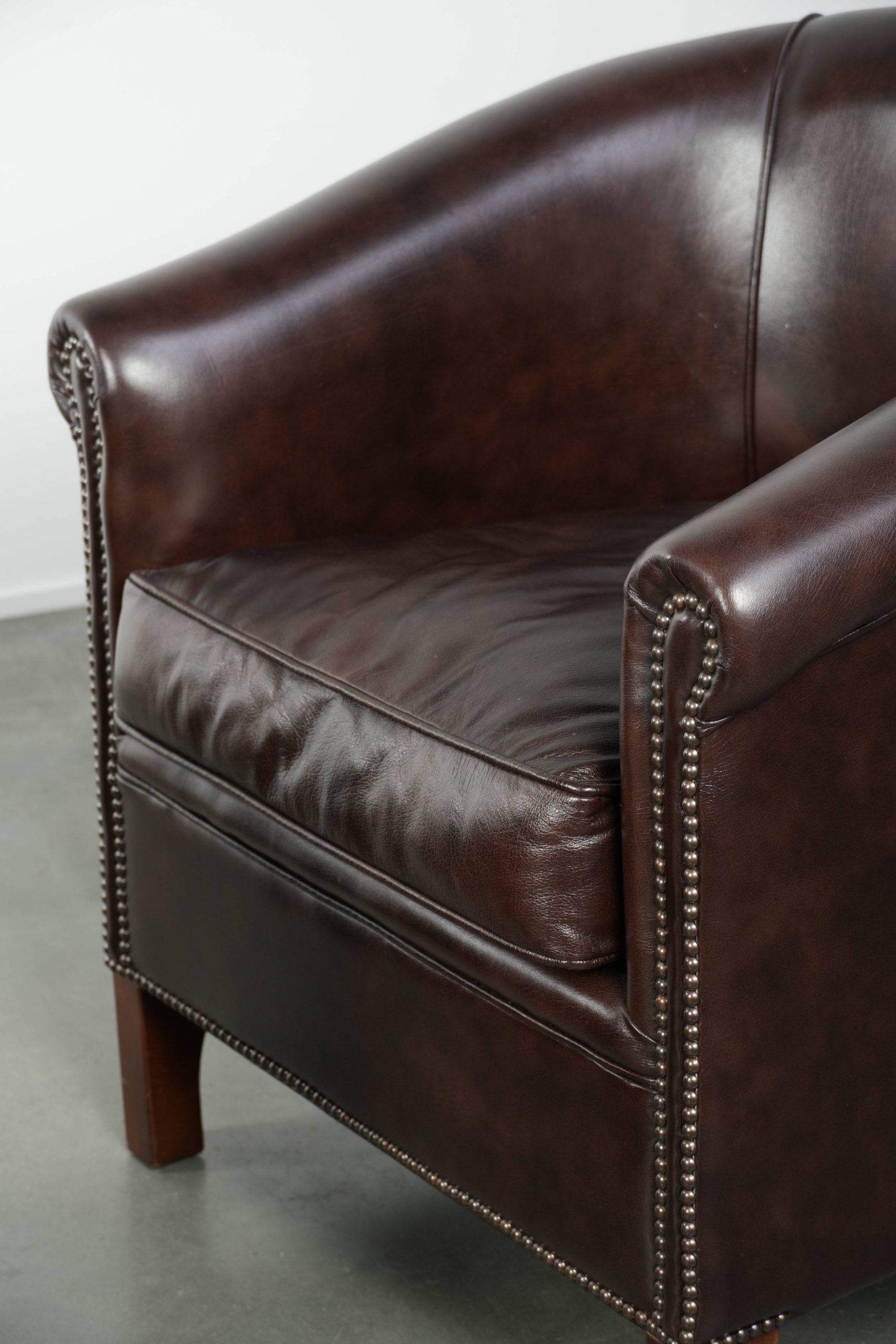Set of two cowhide club armchairs in good condition with a English design