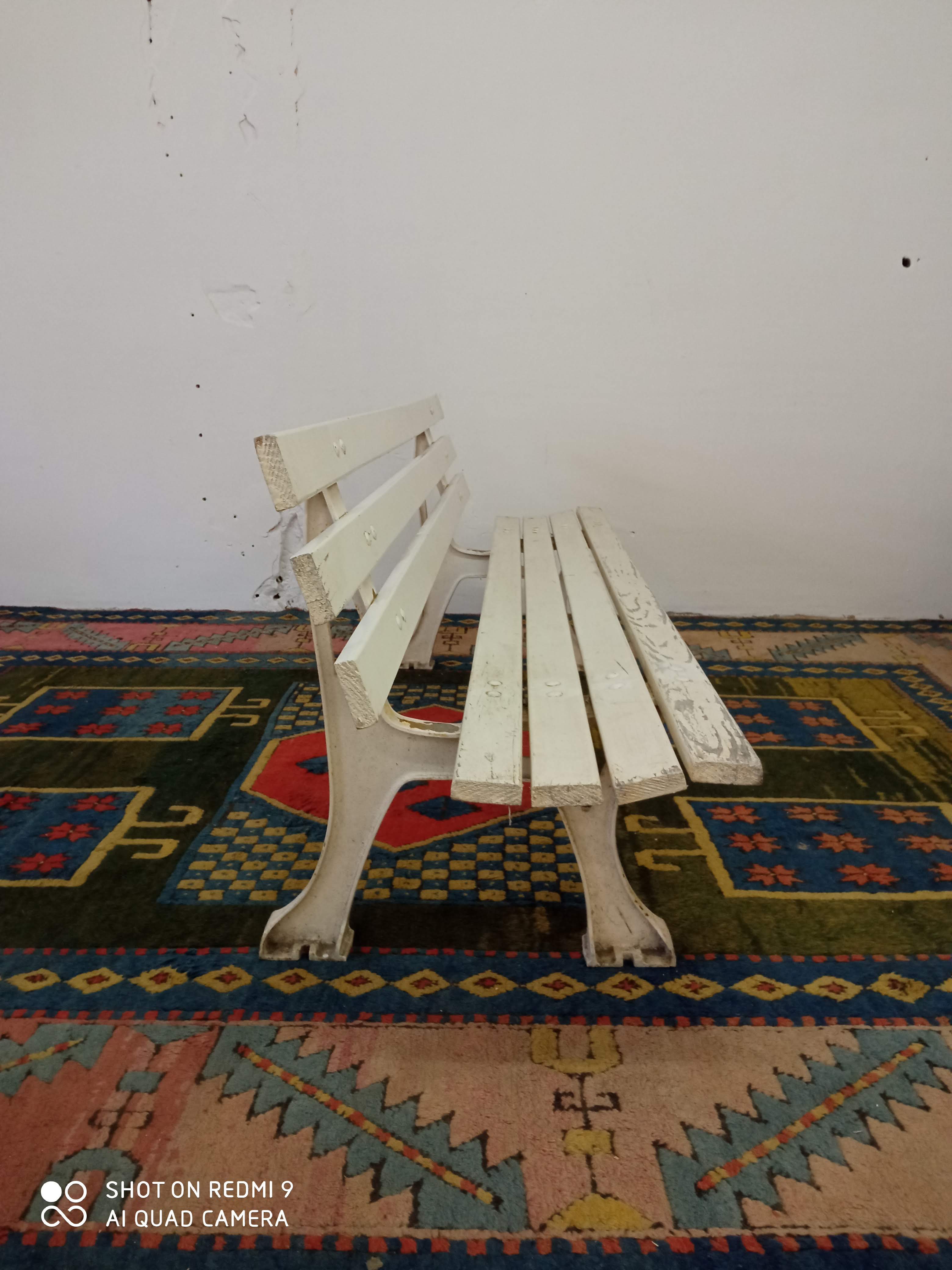 Wooden garden bench and old cast iron