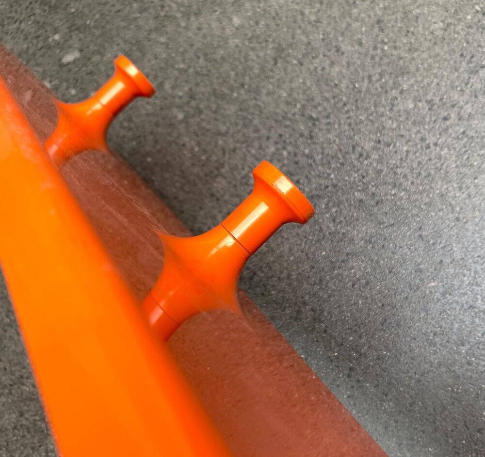 Orange coat rack from the mid-century space age, 1960s.
