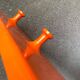 Orange coat rack from the mid-century space age, 1960s.