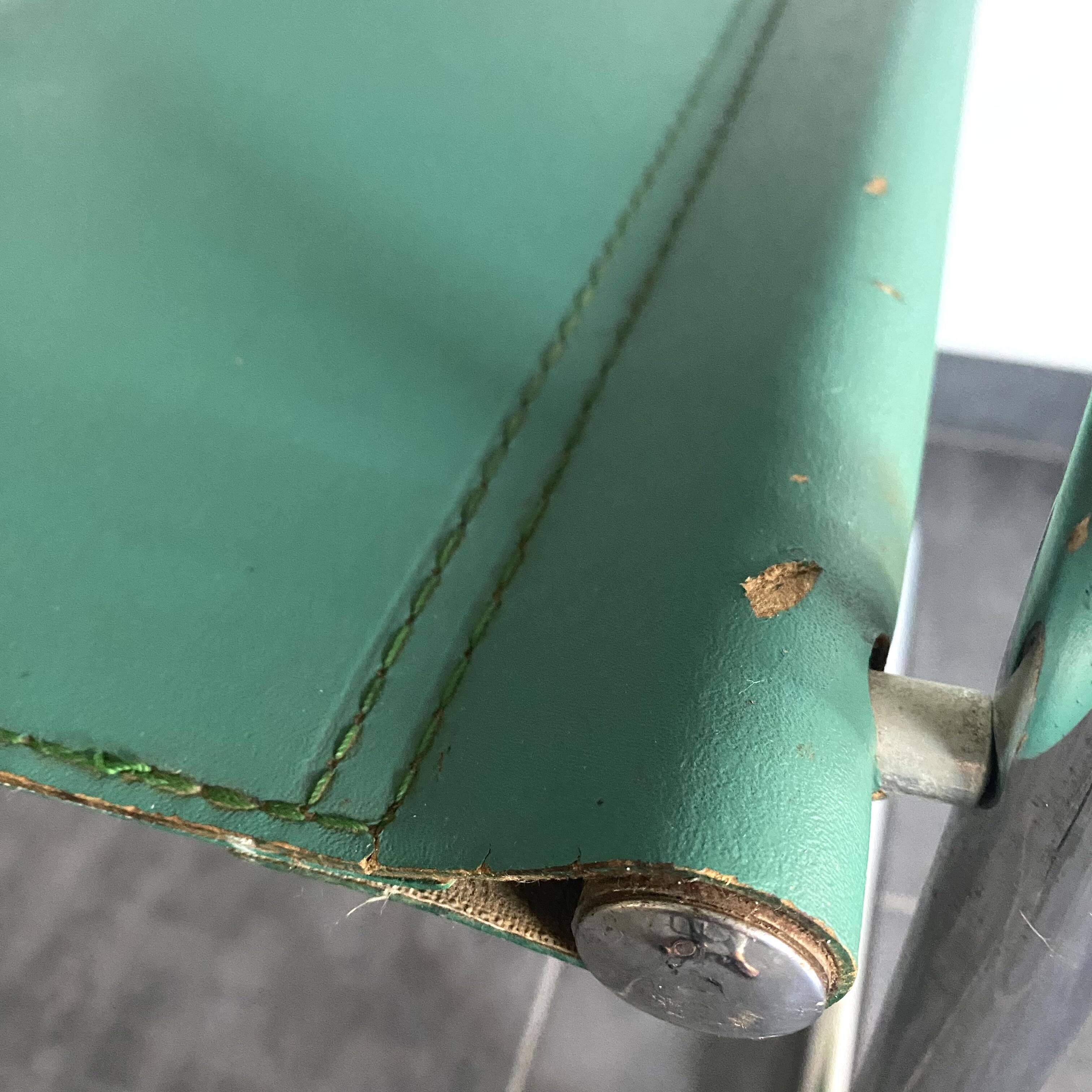 Pair of faux leather and chrome armchairs