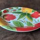 Quadrifoglio dish. Italian. Fruit and flower decoration. Shimmering colors.