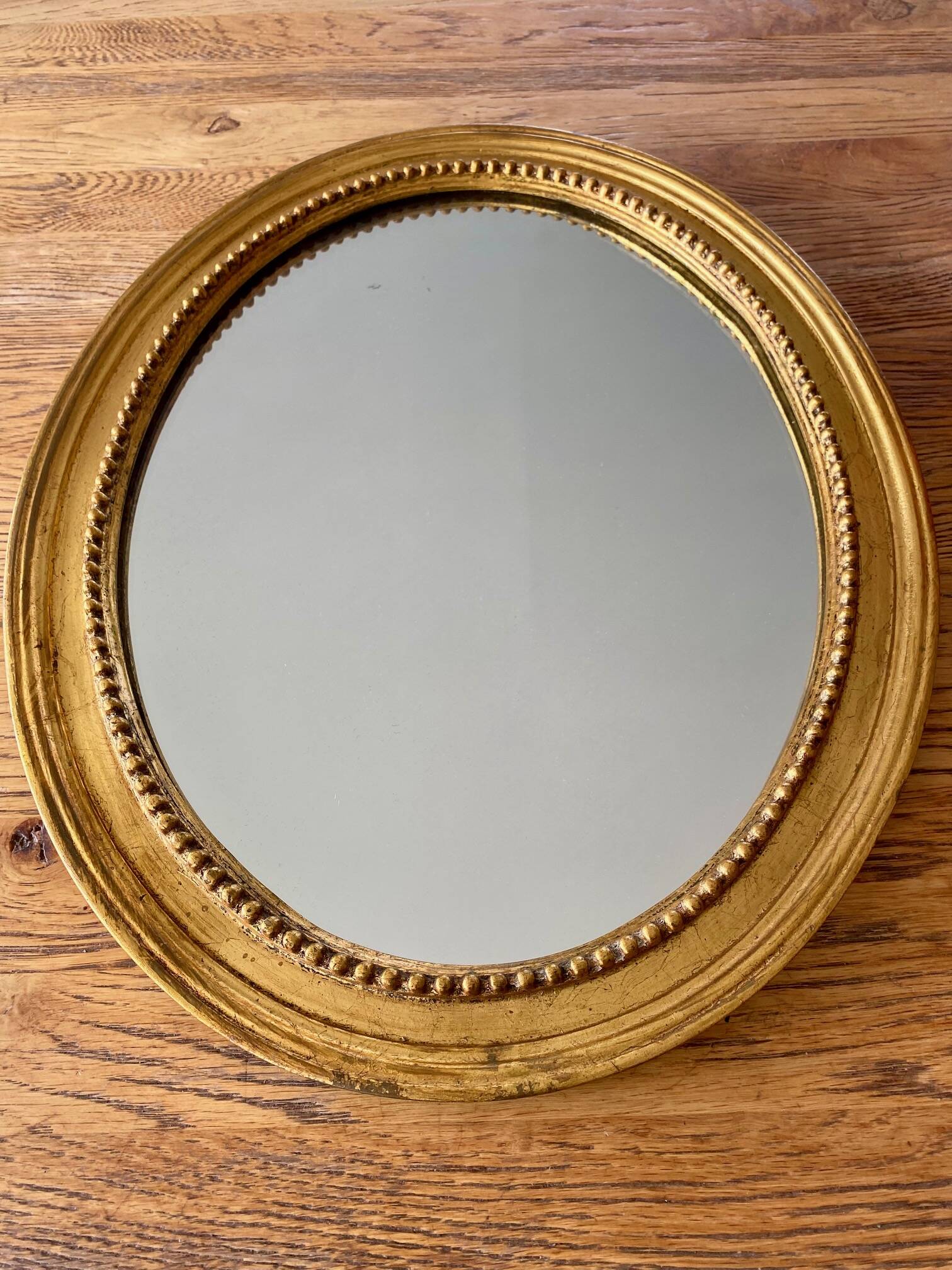 Antique gold oval mirror