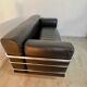 Old vintage leather and tubular metal sofa, design 70s