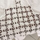 Net-style embroidered cotton tablecloth.