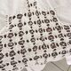 Net-style embroidered cotton tablecloth.