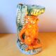 Zoomorphic pitcher in slipware, monkey.