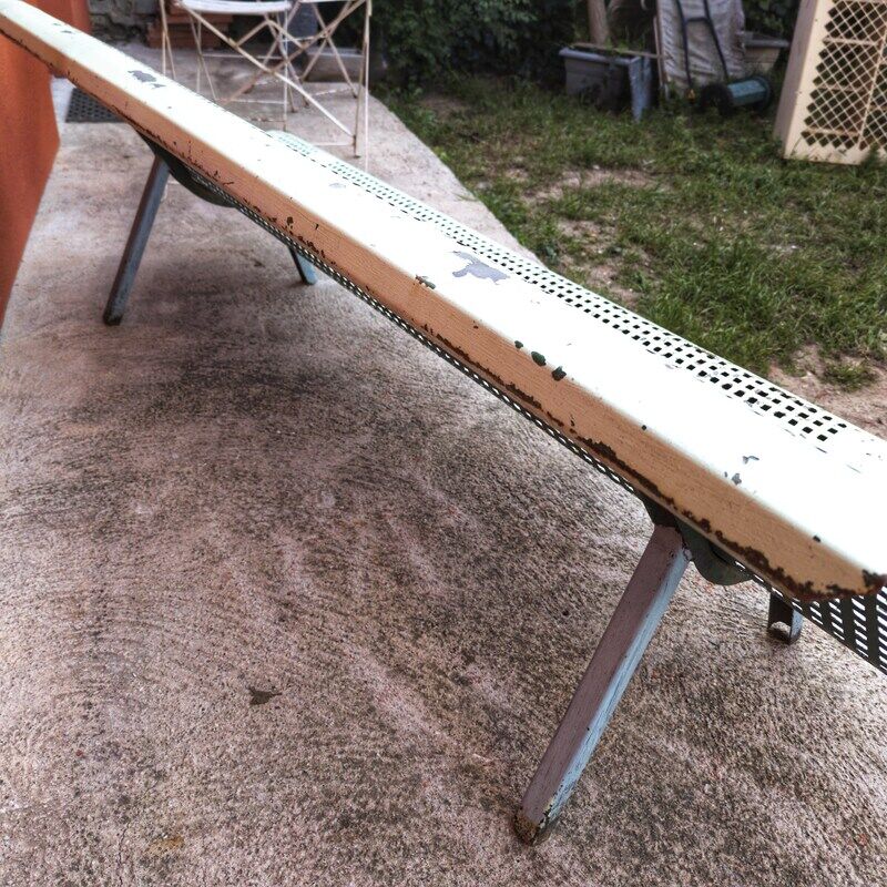 Public bench made of perforated iron