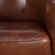 Vintage sheepskin club armchair in English style with deep colours