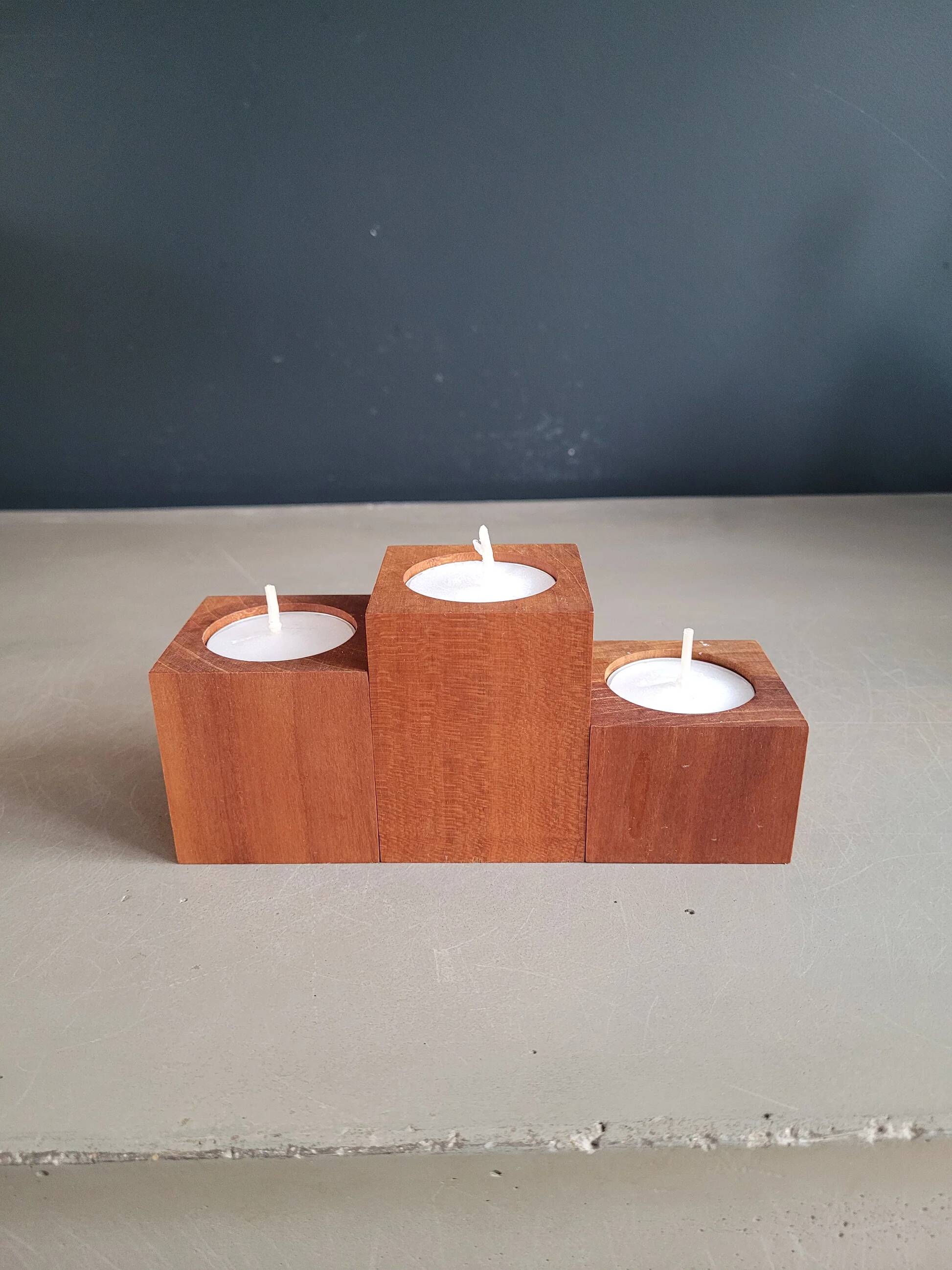 Vintage teak candlestick trio