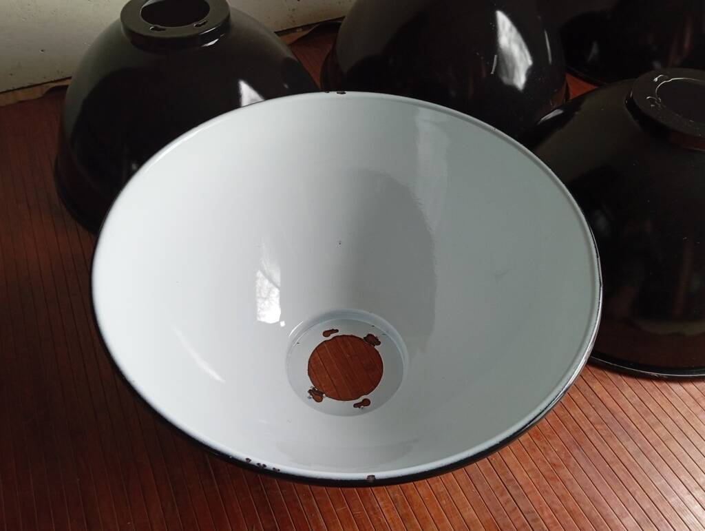 Set of 10 large industrial enamelled metal pendants.