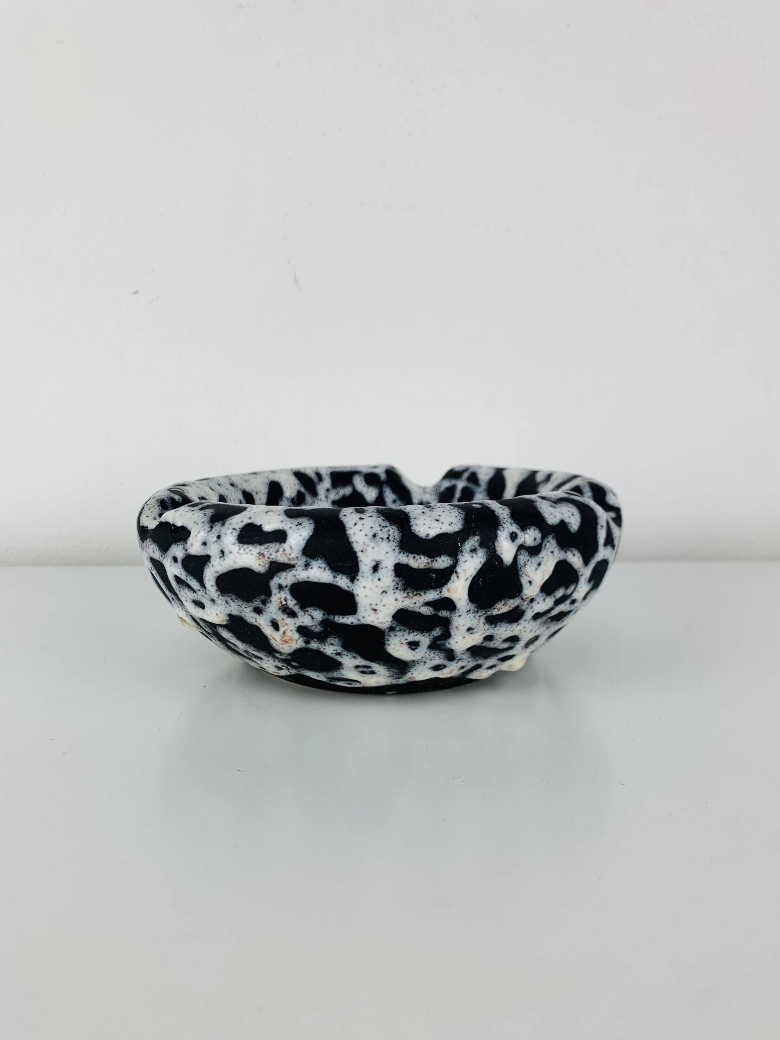 Ashtray and pocket tray by Marius Giuge, fat lava ceramic.