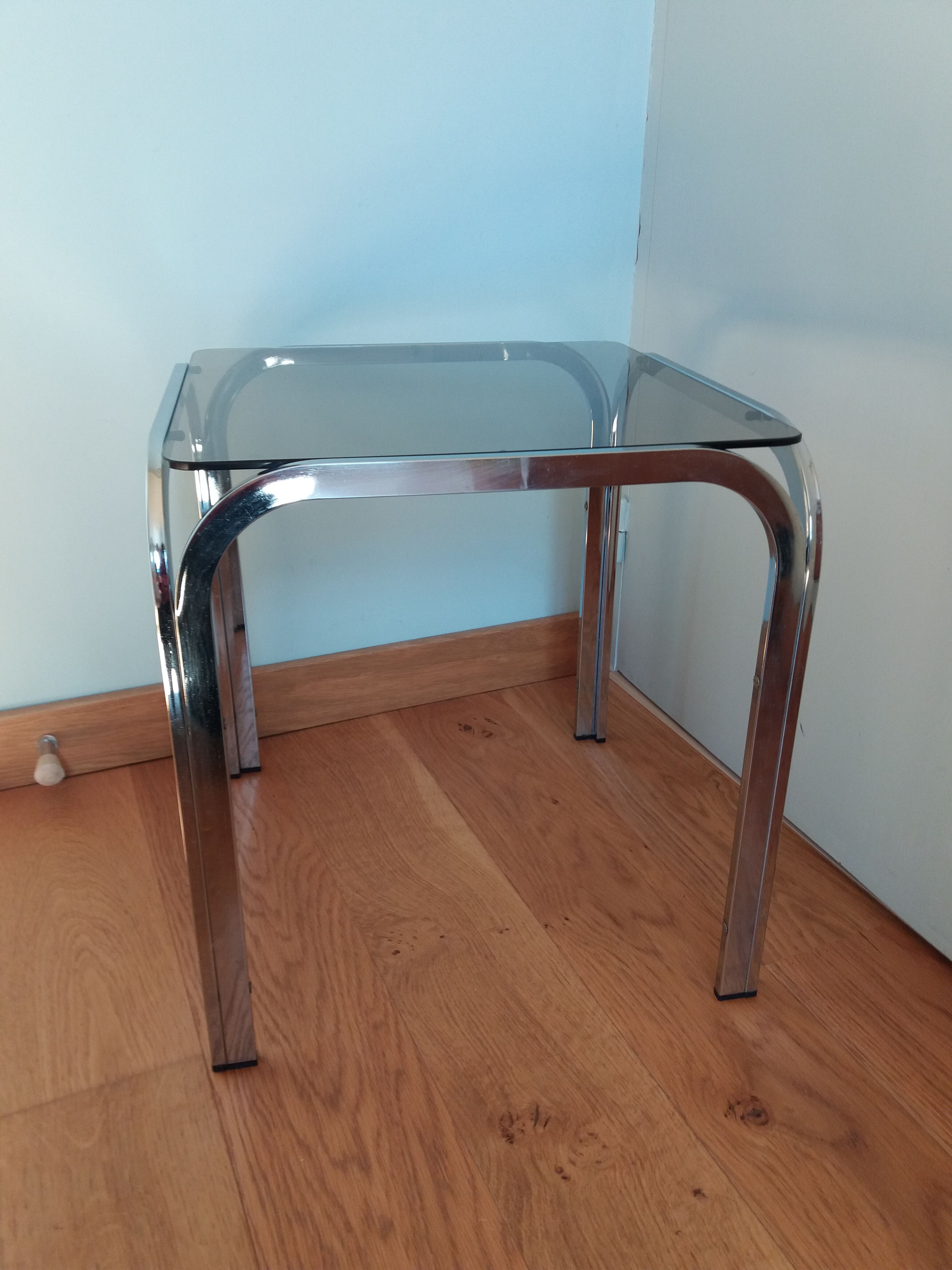 Square coffee table in chromed metal and smoked glass