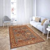 Oriental rug in beige, blue, and red wool.