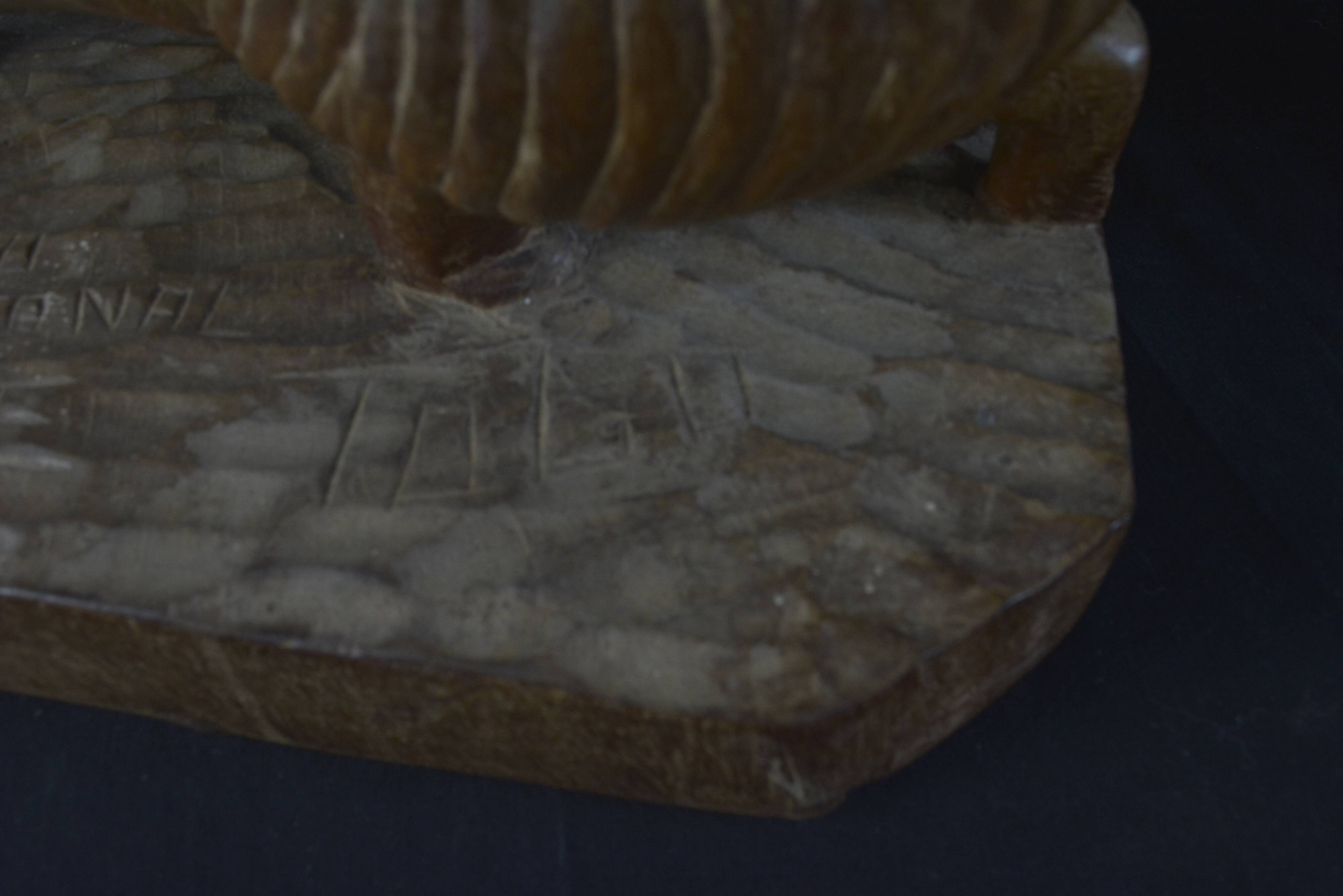 Togolese ethnic stool in carved exotic wood.