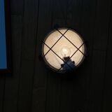 Waterproof industrial porthole light in Bakelite with a glass globe.